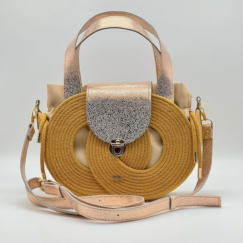 Mustársárga EVA Infinity limitált designer női táska egymásba fonódó karika mintával és valódi bőr kiegészítőkkel a NADRI Bags kollekcióból.