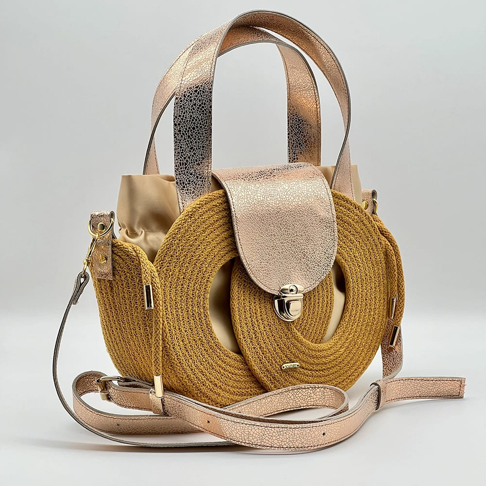 Mustársárga EVA Infinity limitált designer női táska egymásba fonódó karika mintával és valódi bőr kiegészítőkkel a NADRI Bags kollekcióból.