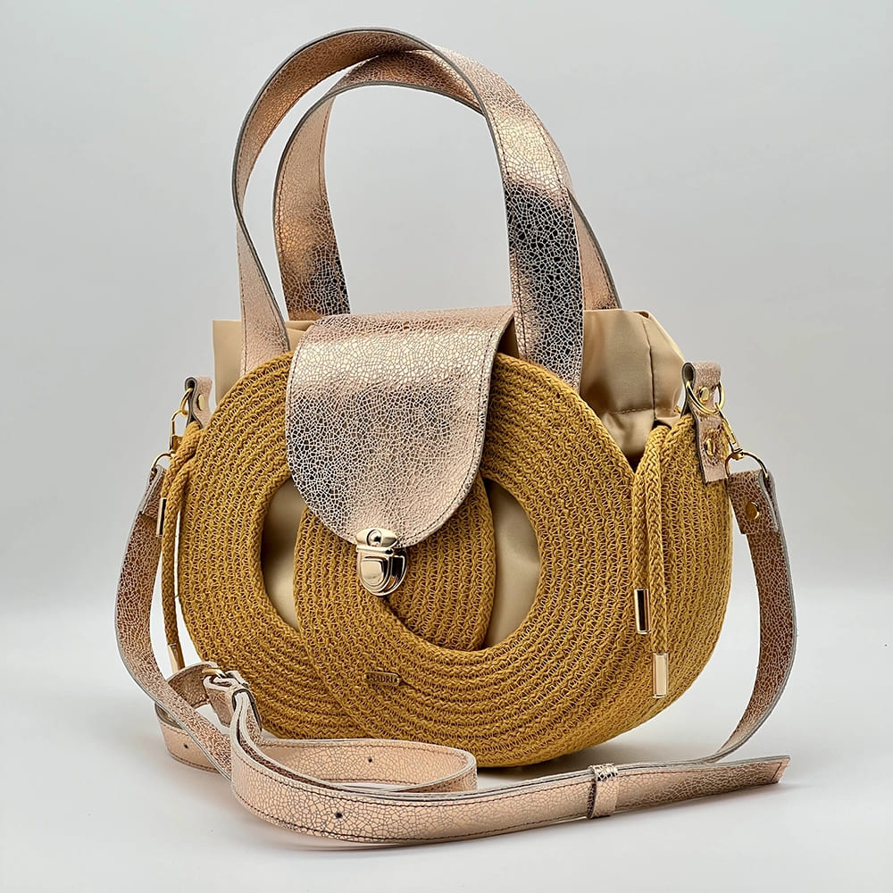 Mustársárga EVA Infinity limitált designer női táska egymásba fonódó karika mintával és valódi bőr kiegészítőkkel a NADRI Bags kollekcióból.