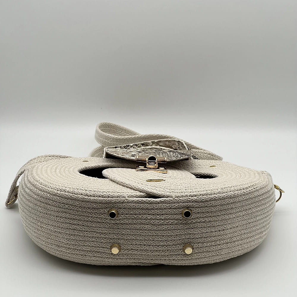 Natúr színű EVA Infinity limitált designer női táska egymásba fonódó karika mintával és valódi bőr kiegészítőkkel a NADRI Bags kollekcióból.