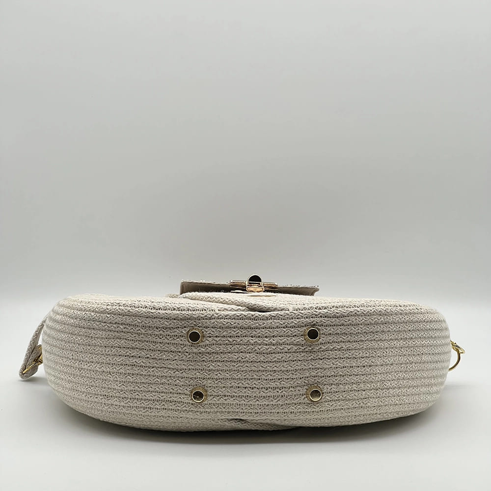 Natúr színű EVA Infinity limitált designer női táska egymásba fonódó karika mintával és valódi bőr kiegészítőkkel a NADRI Bags kollekcióból.